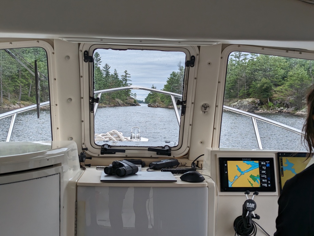 Figure 241: Captain Brigid piloting Penguin through Go Home Chute, Georgian Bay, ON